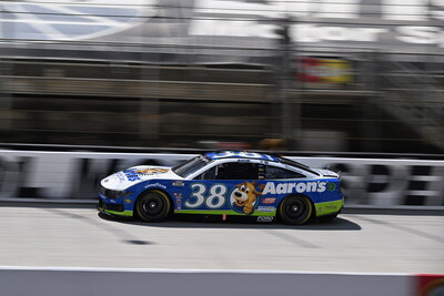 Zane Smith drives the No. 38 Aaron’s Ford Mustang Dark Horse, featuring the beloved Lucky Dog mascot.