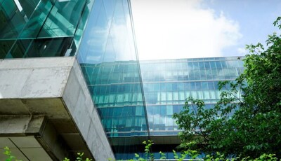 Close up of building with sun peaking through clouds (CNW Group/Canada Infrastructure Bank)