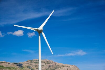 Wind turbine generating electricity over a blue sky. (CNW Group/Canada Infrastructure Bank)