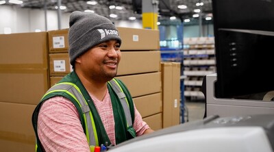 Kase employee at packing station