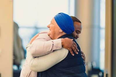 Patient Azra hugs a Parkview team member.