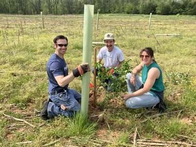 From left, Matt Schaber, a Potomac Edison employee volunteer; Simon Arendt, program director for Stream Link Education; and volunteer Jackie Gianios at a tree planting event in Emmitsburg, Maryland. Employee volunteers from Potomac Edison have planted more than 2,000 company-donated trees across the company's service territory in 2025.