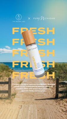 The Pure Michigan FRESH fragrance in a 4 oz. frosted glass bottle with a sunny Michigan beach in the background, hinting of breezy summer days on the fresh coast.