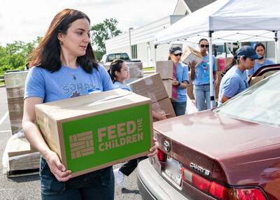 (Credit: Chip McCrea) StarKist staff and volunteers distributing kits designed to support a family of four with up to 20 meals.