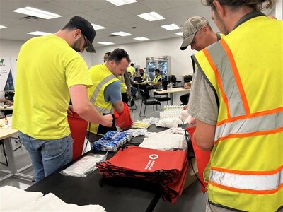 Our Milford, Mass. Team participating in a service to armed forces kit build with the American Red Cross in honor of Day of Caring.