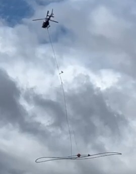 Geophysics array slung under a helicopter (CNW Group/Cupani Metals Corp.)