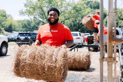 A volunteer arranging pine straw at the Montgomery zoo. Church of the Highlands members served on projects meeting physical and spiritual such as home repairs, meal deliveries, hospital visits, school cleanups, and more.