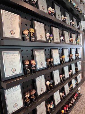 Cognizant’s AI Lab displays 59 patents, with space for the 23 pending patents. The Lab celebrates each inventor with a U.S. Patent plaque and a FunkoPop figurine of their choice.