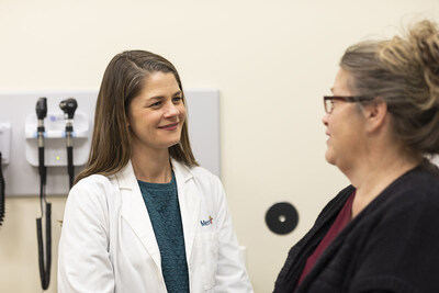 Dr. Molly Ehlman, left, a Mercy geriatrician, said DAX “makes it possible to focus on the person in front of me instead of the computer screen. I can look patients in the eyes and really hear what they’re saying without worrying about typing notes during their visit. It allows me to spend less time in front of a computer and more time on the aspects of patient care that matter most."