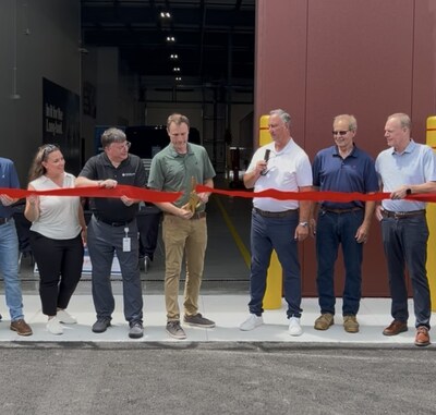 Employees and Leadership from Fleet Services by Cox Automotive gathered for a ribbon cutting