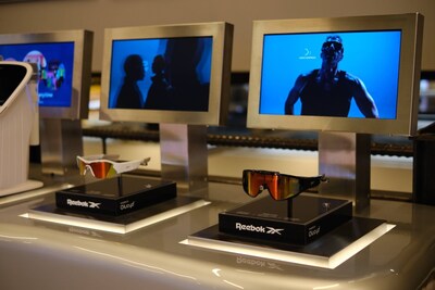 Reebok Powered by Lucyd frames on sale at the TM:RW store in Times Square. The screens play continuous Reebok X Lucyd marketing content. Image courtesy Innovative Eyewear, Inc.