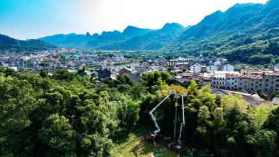 Image Above: State Grid Zhejiang Electric Power crews relocate power lines