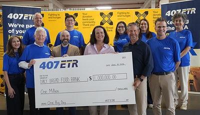 Left of centre: Jose Espinosa, President & CEO, 407 ETR, Lee Fairclough, MPP for Etobicoke-Lakeshore and Neil Hetherington, CEO of Daily Bread Food Bank, are joined by members of the 407 ETR Board and Executive team for the cheque presentation.
