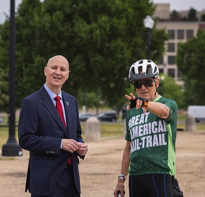 Senator Pete Ricketts (R-NE) and Vietnam veteran Winston Hall of Elkhorn, Nebraska, talk at a May 21 event at the U.S. Capitol to celebrate a team of veterans embarking on a cross-country bike ride. The ride is made possible through a partnership with Rails to Trails Conservancy, the nation's largest trails advocacy organization, and WarriorExpeditions, an outdoor therapy program for veterans. Photo by Cedric Craig, courtesy of Rails to Trails Conservancy. 