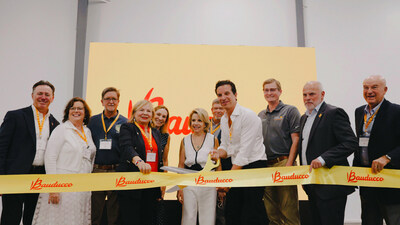 Bauducco International Business Unit CEO and Bauducco family members are joined by the Zephyrhills Mayor and state and local officials for a ribbon cutting celebrating the grand opening of Bauducco's largest U.S. manufacturing facility in Zephyrhills, Florida.