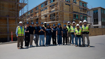 Brookfield Residential team members Brian Radley, Vice President, Housing Operations, Southern California; Rico Green, Assistant Site Manager; Ken Hesse, Superintendent; Oscar Salazar, Superintendent; Sean Jackson, Safety & Quality Manager; Juan Bernal, Superintendent; and Darren Adamson, Assistant Superintendent, are pictured with PUSD student participants at an active construction site.