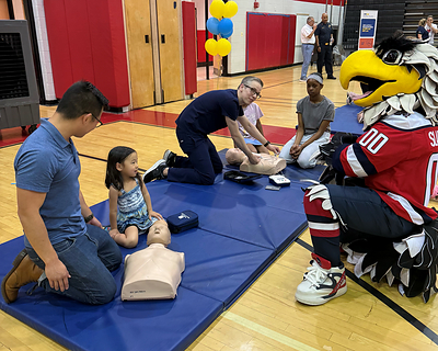 Nearly 100 people attended the third annual hands-only CPR and AED training event designed to empower everyone to step up to help save lives. 