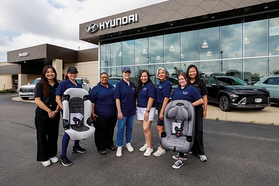 Hyundai and Lurie Children’s employees volunteer at a car seat safety event at Wilkins Hyundai in Elmhurst, Ill., on June 6, 2026. (Photo/Hyundai)
