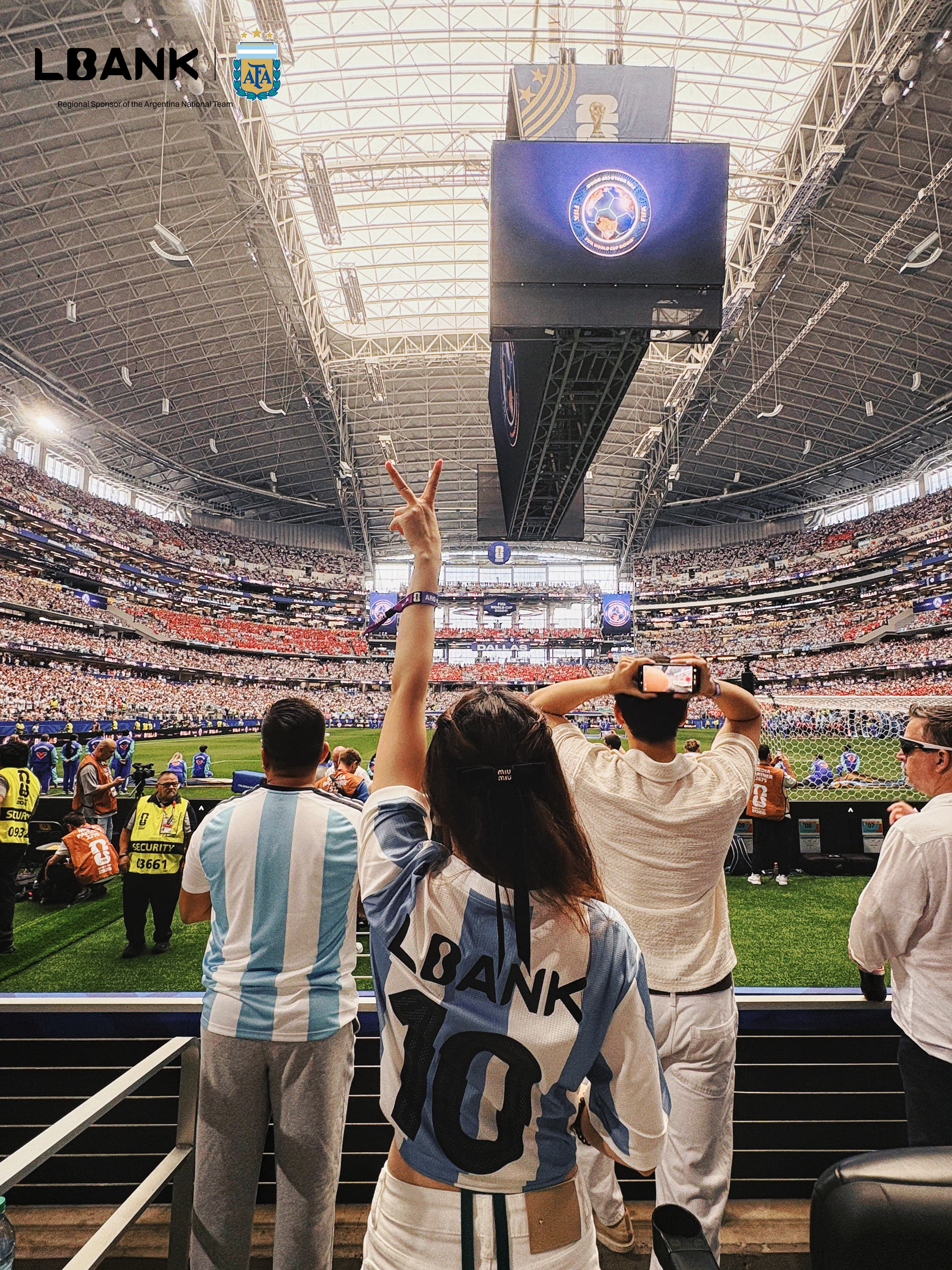 LBank Marketing & Partnership VP Kaia wearing an Argentina shirt with 'LBANK 10' on the back, gesturing a peace sign while overlooking the football pi