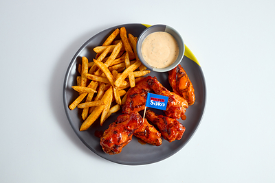 A PERi-PERi Saka chicken and chips meal.