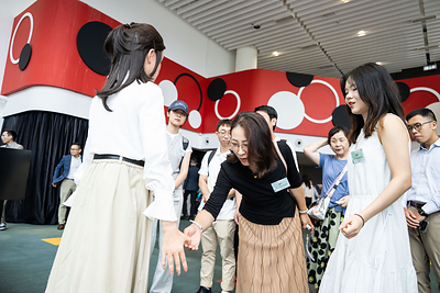 Attendees engage in live interactions with the humanoid robot and thoroughly enjoy the experience.
