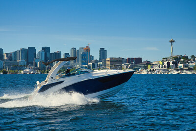 Testing with a view: The 2026 Regal 26 Express Cruiser undergoes authorized functional speed testing on Lake Union's designated course, framed by Seattle