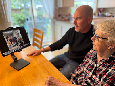 Matt Tullis and his mother interact with Val -- a smart companion for families and caregivers living with dementia