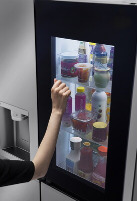The LG InstaView™ refrigerator allows users to check its contents without opening the door by simply knocking twice on the glass panel. (PRNewsfoto/LG Electronics)