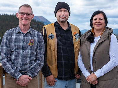 Member of Parliament for the Yukon and Parliamentary Secretary for Northern and Arctic Affairs Dr. Brendan Hanley, Ross River Dena Council Chief Dylan Loblaw, and Northern and Arctic Affairs Minister Rebecca Chartrand at Tsē Zūl Camp. Photo Credit: Peter Mather and Dena Nezziddi Development Corporation
