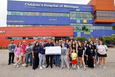 (From center left to right) Raelynn Blackwell, corporate social responsibility, Hyundai Motor North America; Angela Hurst, director of patient care services, Children's Hospital of Michigan; Ben Michajlyszyn, director, safety test and investigation laboratory, Hyundai Motor North America; Therese Quattrociocchi-Longe, impact director, Children's Foundation of Michigan; Renee Zarr, injury prevention coordinator, Children's Hospital of Michigan and child passenger safety instructor, National Highway Traffic Safety Administration in Troy, Mich., on Sept. 12, 2026 (Photo/Hyundai)