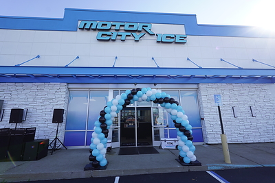 Building entrance day of grand opening celebration.