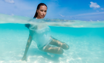 Adriana Lima shot by Russell James for Baccarat Residences Maldives.