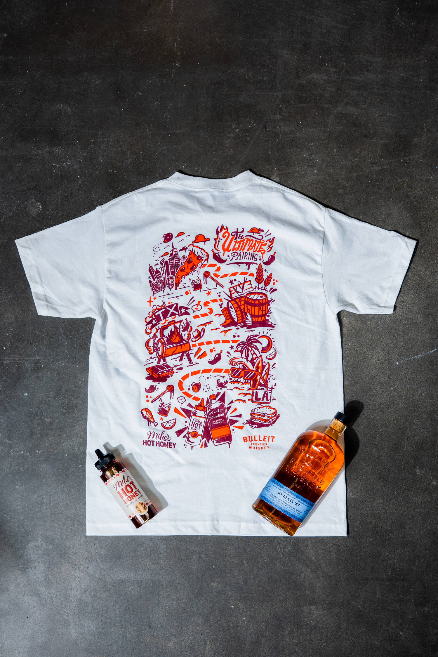 Custom Bulleit Frontier Whiskey x Mike's Hot Honey tee-shirt, illustrated by Diego Aguilar and available on the Mike's Hot Honey website while supplies last Custom Bulleit Frontier Whiskey x Mike's Hot Honey tee-shirt, illustrated by Diego Aguilar and available on the Mike's Hot Honey website while supplies last