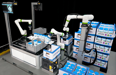 A coordinated work cell featuring FANUC CRX-20iA/L, CRX-10iA and CRX-5iA collaborative robots demonstrate an end-to-end packaging workflow at the PACK EXPO International 2026 show in Chicago Oct. 18-21.