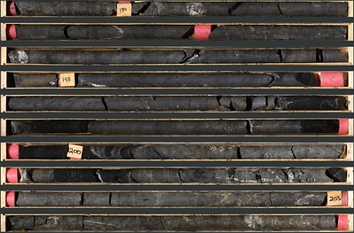 Photo 1: An interval of massive sulphide mineralization in TS26-007 consisting of massive sphalerite, and galena with minor barite and black mudstone from 193.7 to 204.1 m Photo 1: An interval of massive sulphide mineralization in TS26-007 consisting of massive sphalerite, and galena with minor barite and black mudstone from 193.7 to 204.1 m