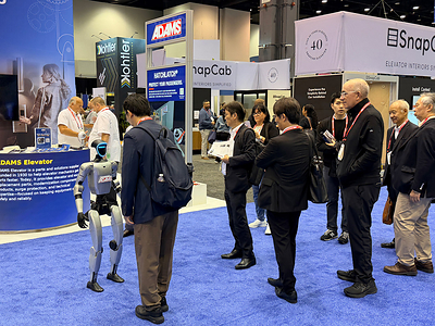 SKYE, Metropolis Robotics’ humanoid robot, greets visitors at the Adams Elevator booth at NAEC 2026, McCormick Place, Chicago. (Photo courtesy of Metropolis Robotics)