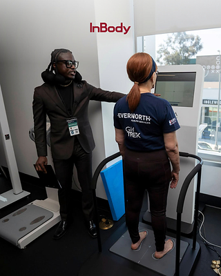 Malcolm Jones, Founder of KRU Sciences and Post Doctoral Research Associate with USC's Division of Biokinesiology and Physical Therapy, assists a participant using the InBody FRA 510S. Malcolm Jones, Founder of KRU Sciences and Post Doctoral Research Associate with USC's Division of Biokinesiology and Physical Therapy, assists a participant using the InBody FRA 510S.