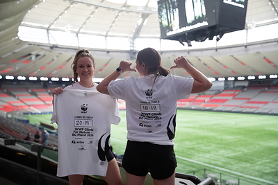 Lindsay Carey and a friend show off their climb times after finishing the course. 