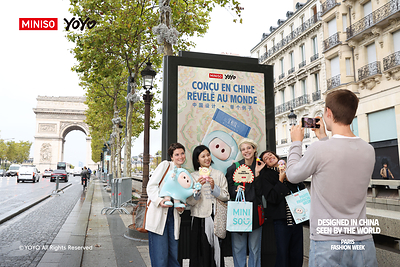 YOYO Engages Fans near the Arc de Triomphe During Paris Fashion Week