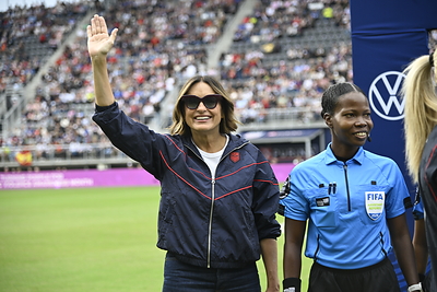 In partnership with Purina, Mariska Hargitay participates in the pre-match coin toss at the U.S. Women's National Team match against Spain on October 10, 2026, at Audi Field. Hargitay served as Purina's Honorary Captain to highlight the Purple Leash Project and raise awareness for domestic violence survivors and their pets during Domestic Violence Awareness Month. Credit to U.S. Soccer
