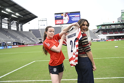 Actress and domestic violence advocate Mariska Hargitay meets with U.S. Women's National Team player Rose Lavelle at the U.S. Women's National Team match against Spain on October 10, 2026. Hargitay served as Purina's Honorary Captain to raise awareness for the Purple Leash Project and domestic violence survivors and their pets during Domestic Violence Awareness Month. Credit to U.S. Soccer