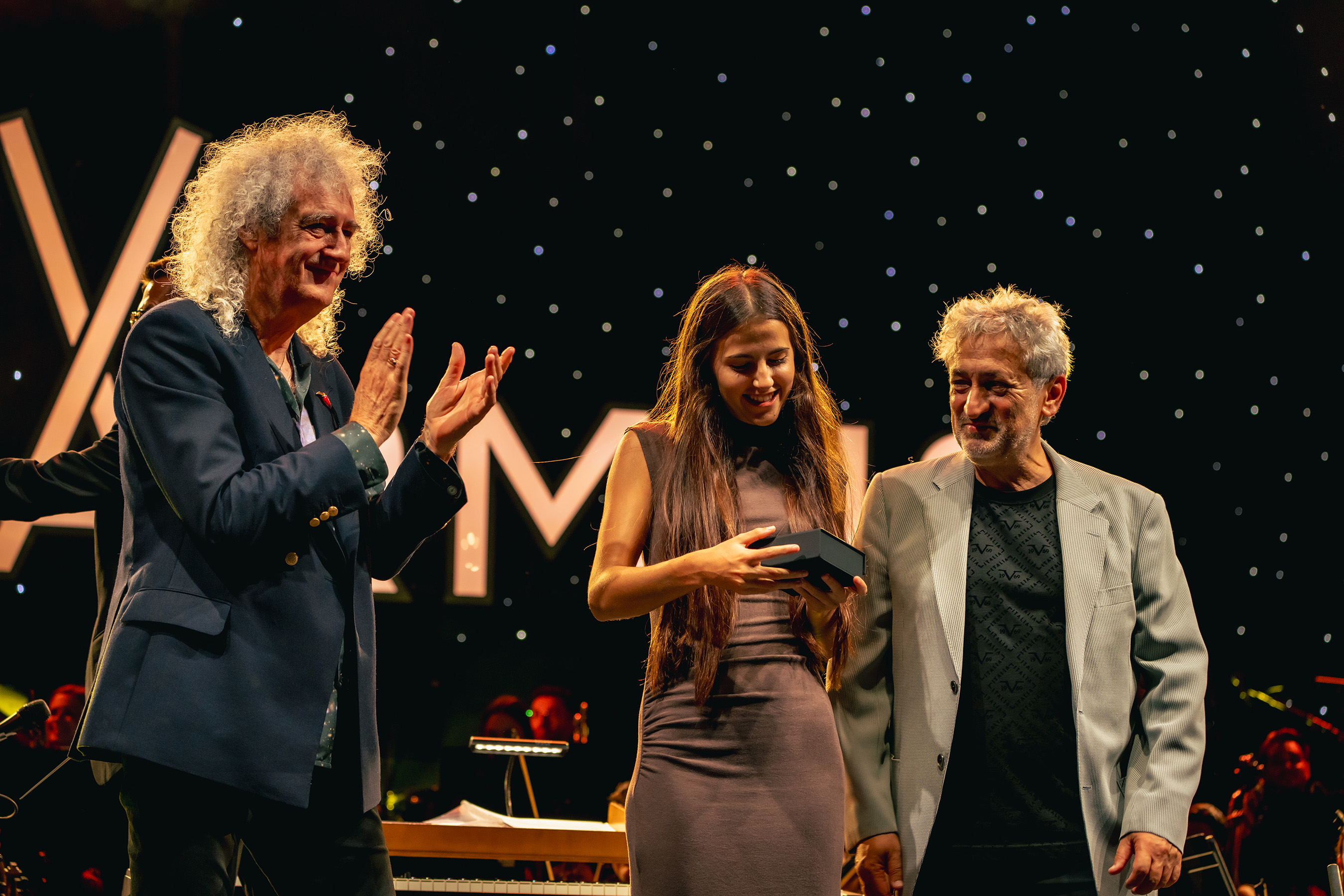Valeria Coralles, Stephen Hawking Junior Medal Recipient and Starmus Co-Founders Sir Brian May and Astrophysicist Garik Israelian