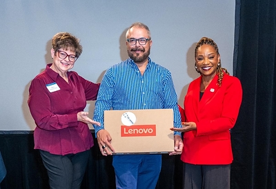 Kelley Cornish, President and CEO of the T.D. Jakes Foundation, and Maria Hazan-Cohen, Vice President and Community Manager of JPMorganChase gifting a laptop to a jobseeker.
