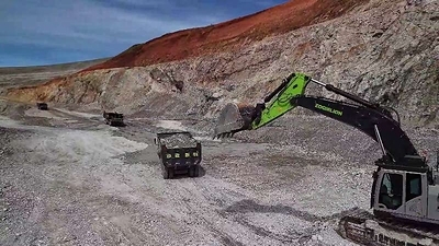 Zoomlion mining excavators and mining dump trucks operate at an open-pit mine in Inner Mongolia, China